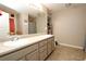 Bathroom with double vanity sinks, tiled floors and neutral paint palette at 67 Mossy Oak Ln, Dallas, GA 30157