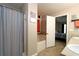 Bathroom featuring shower-tub combo and access to the main bedroom at 67 Mossy Oak Ln, Dallas, GA 30157