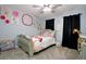 Cozy bedroom featuring charming princess-themed decor and soft gray walls at 67 Mossy Oak Ln, Dallas, GA 30157