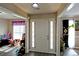 Front door with sidelights leads to rooms with neutral paint, trim, and plank floors at 67 Mossy Oak Ln, Dallas, GA 30157