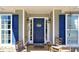 Inviting front entrance featuring a blue door, stylish lanterns, and a welcoming wreath at 67 Mossy Oak Ln, Dallas, GA 30157