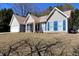 Attractive single story house with blue shutters, attached garage, and mature landscaping at 67 Mossy Oak Ln, Dallas, GA 30157