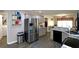 Bright kitchen with gray cabinets, stone countertops, and stainless steel appliances at 67 Mossy Oak Ln, Dallas, GA 30157