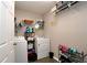 Functional laundry room equipped with a washer, dryer, and storage shelving at 67 Mossy Oak Ln, Dallas, GA 30157