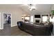 Open concept living room featuring brick fireplace and hardwood-style floors at 67 Mossy Oak Ln, Dallas, GA 30157