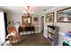 Cozy living room featuring a rocking chair, a buffet, and natural light at 67 Mossy Oak Ln, Dallas, GA 30157