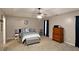 Spacious main bedroom with a ceiling fan, blue accents, and carpet flooring at 67 Mossy Oak Ln, Dallas, GA 30157