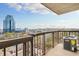 Large balcony with railings overlooking the city with skyline views at 795 Hammond Dr # 1405, Atlanta, GA 30328
