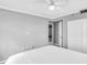 Spacious bedroom with ceiling fan, view to the en-suite bathroom, and large closet at 795 Hammond Dr # 1405, Atlanta, GA 30328