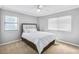 This bright bedroom features neutral colors, updated ceiling fan, and two large windows at 795 Hammond Dr # 1405, Atlanta, GA 30328