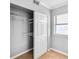 Walk-in closet with adjustable shelving, a window and a sliding door entrance at 795 Hammond Dr # 1405, Atlanta, GA 30328