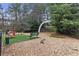 Fully fenced dog park features a gravel groundcover, bench seating, and agility equipment for furry friends to enjoy at 795 Hammond Dr # 1405, Atlanta, GA 30328