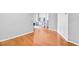 Hardwood hallway leading into the living room, creating a seamless flow between spaces at 795 Hammond Dr # 1405, Atlanta, GA 30328
