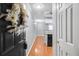 Compact kitchen featuring hardwood floors, white cabinetry and a modern appliance package at 795 Hammond Dr # 1405, Atlanta, GA 30328