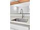Close-up of a kitchen sink with stainless steel faucet and quartz countertops at 795 Hammond Dr # 1405, Atlanta, GA 30328
