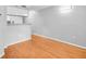 Spacious living area featuring hardwood floors and a glimpse into the kitchen at 795 Hammond Dr # 1405, Atlanta, GA 30328