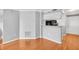 Open-concept living room with hardwood floors and a view into the kitchen area at 795 Hammond Dr # 1405, Atlanta, GA 30328