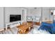 Open living room with comfortable seating, wooden coffee table, and views into the kitchen at 795 Hammond Dr # 1405, Atlanta, GA 30328