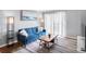 Comfortable living room featuring modern decor, a wooden coffee table, and balcony access at 795 Hammond Dr # 1405, Atlanta, GA 30328