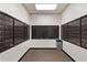 Interior shot of residential mailroom with individual mailboxes and waste receptacle at 795 Hammond Dr # 1405, Atlanta, GA 30328