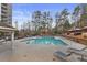 Community pool with lounge chairs, shade umbrellas, and surrounding landscaping at 795 Hammond Dr # 1405, Atlanta, GA 30328