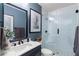 Modern bathroom features a glass shower, marble countertops, and stylish fixtures at 1354 Fernwood Ne Cir, Brookhaven, GA 30319