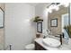 Well-lit powder room featuring white subway tile and marble countertop at 1354 Fernwood Ne Cir, Brookhaven, GA 30319