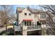 Rear exterior of home with balcony and attached garage at 1354 Fernwood Ne Cir, Brookhaven, GA 30319