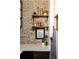 Charming nook with brick backsplash, floating shelves, and elegant decor at 1354 Fernwood Ne Cir, Brookhaven, GA 30319