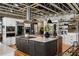 Open-concept kitchen with island, stainless appliances, and custom cabinetry at 1354 Fernwood Ne Cir, Brookhaven, GA 30319
