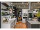 Gourmet kitchen with white cabinets, granite countertops, and stainless-steel appliances in an open layout at 1354 Fernwood Ne Cir, Brookhaven, GA 30319