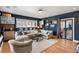 Bright living room with neutral furnishings, hardwood flooring, and a cozy seating arrangement at 1354 Fernwood Ne Cir, Brookhaven, GA 30319