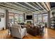 Bright and airy living room with a cozy fireplace, hardwood floors and seamless outdoor access at 1354 Fernwood Ne Cir, Brookhaven, GA 30319