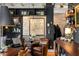 Beautiful living room with bookshelves, leather chairs, bar area, and exposed ceiling beams at 1354 Fernwood Ne Cir, Brookhaven, GA 30319