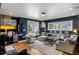 Inviting living area featuring a sectional sofa, built-in desk, and large windows offering abundant natural light at 1354 Fernwood Ne Cir, Brookhaven, GA 30319