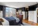 Bedroom with large windows and hardwood floors, offering plenty of natural light at 1354 Fernwood Ne Cir, Brookhaven, GA 30319