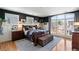 Bright bedroom with large windows, hardwood floors, and a cozy sitting area at 1354 Fernwood Ne Cir, Brookhaven, GA 30319