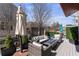 Inviting patio space with comfortable seating, a fire pit, and privacy screens at 1354 Fernwood Ne Cir, Brookhaven, GA 30319