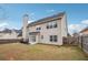 Spacious backyard featuring a patio, lawn, and a privacy fence perfect for relaxation and outdoor activities at 5932 Vinings Vintage Way, Mableton, GA 30126
