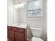Bathroom featuring a wood vanity, white countertop, and toilet at 5932 Vinings Vintage Way, Mableton, GA 30126