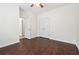 Bedroom featuring hardwood floors, a closet, and a ceiling fan at 5932 Vinings Vintage Way, Mableton, GA 30126