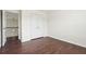 Bedroom with hardwood floors and double closet doors at 5932 Vinings Vintage Way, Mableton, GA 30126