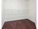 Walk-in closet featuring wire shelving and wood-look flooring at 5932 Vinings Vintage Way, Mableton, GA 30126