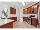 Well-lit kitchen features stainless steel appliances, wood cabinets, and white countertops at 5932 Vinings Vintage Way, Mableton, GA 30126
