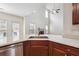 Kitchen island overlooking living room with high ceilings and a fireplace at 5932 Vinings Vintage Way, Mableton, GA 30126