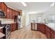 Spacious kitchen with stainless steel appliances, wood cabinets, and tiled floors at 5932 Vinings Vintage Way, Mableton, GA 30126
