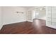 Living room with wood-look floors and french doors leading to the main bedroom at 5932 Vinings Vintage Way, Mableton, GA 30126