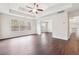 Large main bedroom offers tray ceiling, fan, and natural light from multiple windows at 5932 Vinings Vintage Way, Mableton, GA 30126