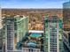 Exterior aerial showcases luxurious high-rise condos with pool and outdoor amenity deck at 943 Peachtree Ne St # 1108, Atlanta, GA 30309