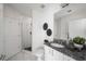 Bright bathroom featuring a glass shower with white subway tile and granite countertops at 943 Peachtree Ne St # 1108, Atlanta, GA 30309